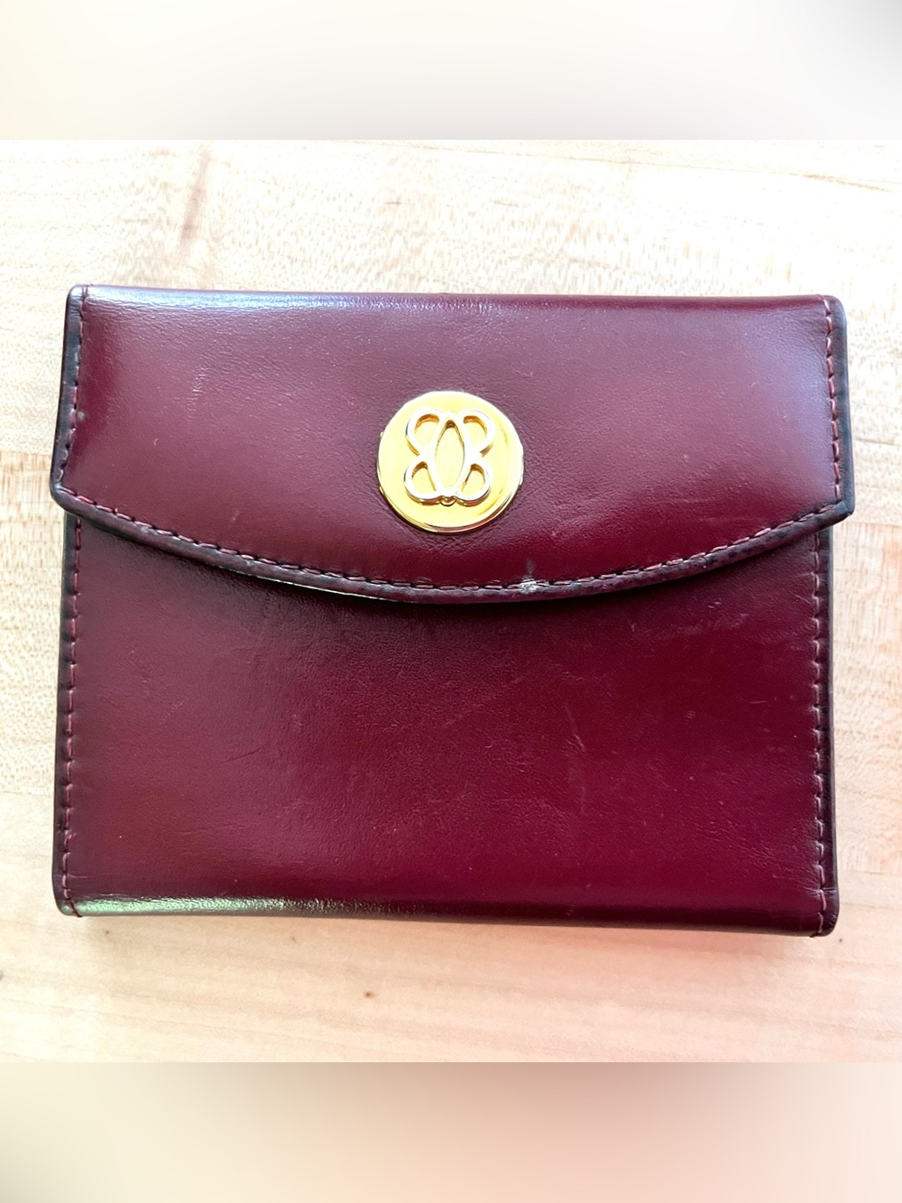 Bosca Deep Burgundy Leather Wallet with Gold Medallion
